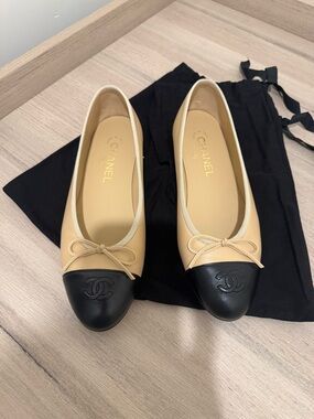 CHANEL Beige Leather Ballet Flats with Black Cap Toe and Bow